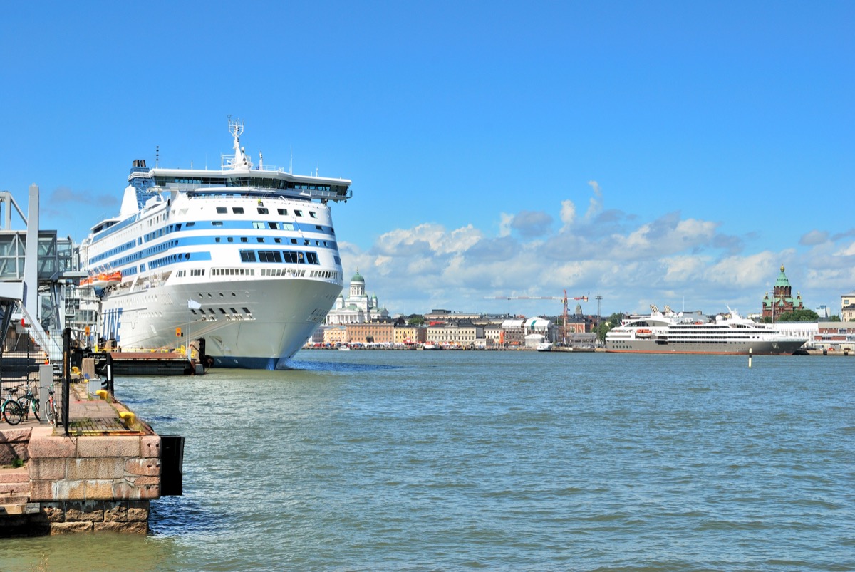 Cruise ship at Helsinki's South Harbour with the domes of the city skyline behind